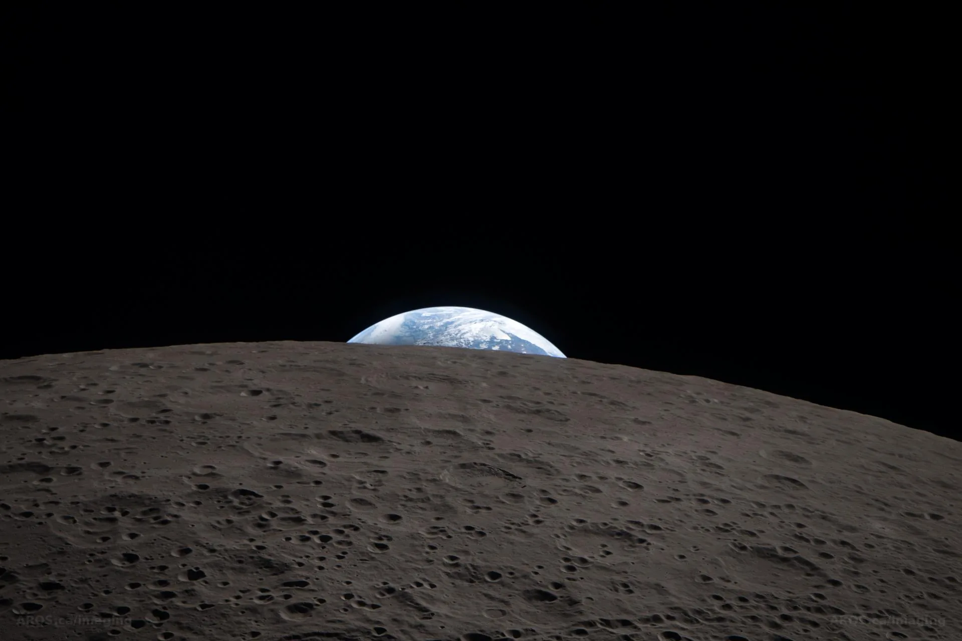 Earth rising over the Moon